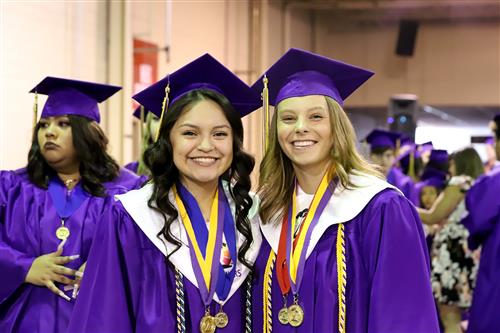 Elaine and Sage smiling together at Graduation