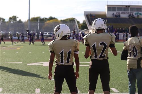 Walnut Middle School football players on the sideline