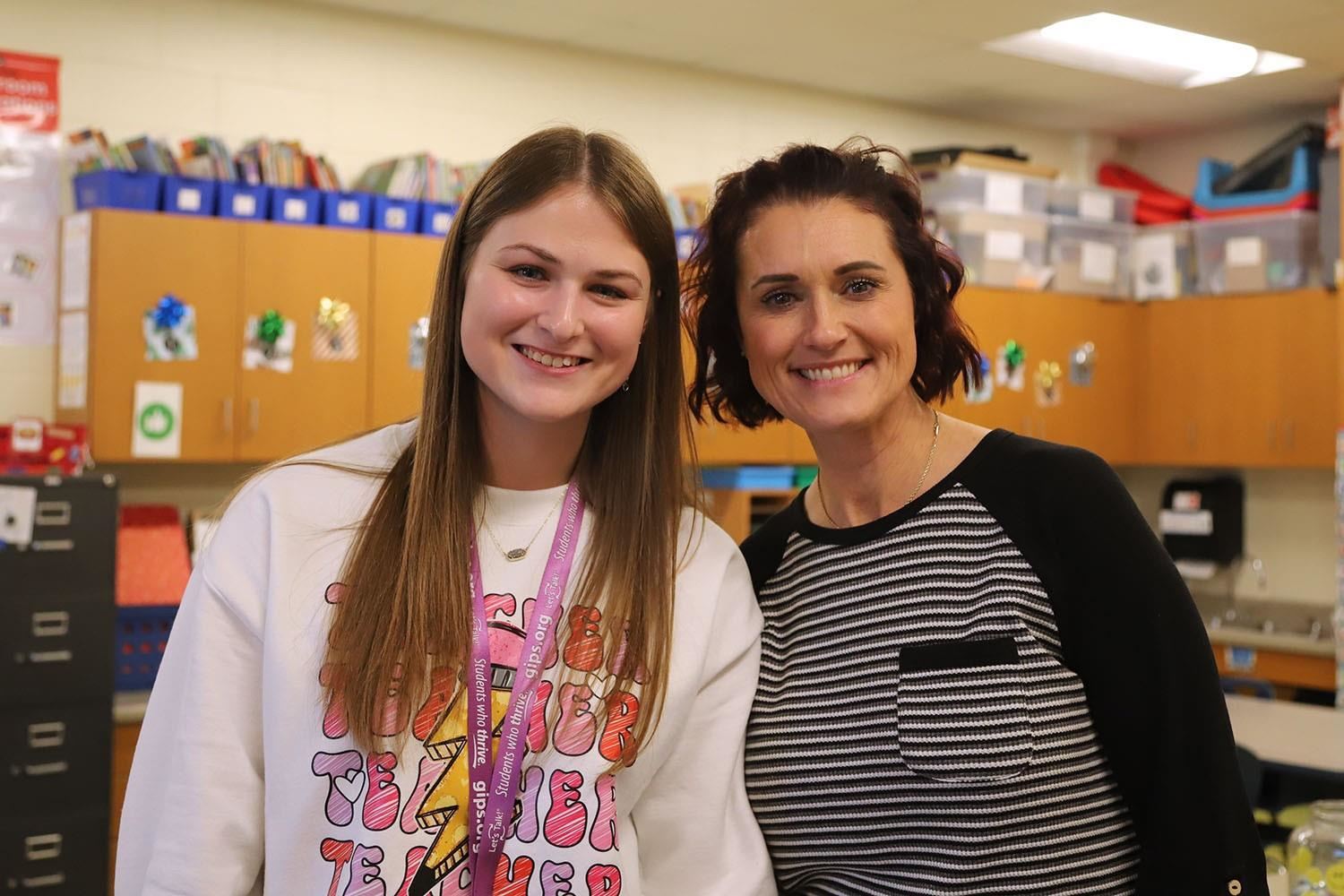 Miss Guererro & Mrs. Waind smiling in a Kindergarten classroom