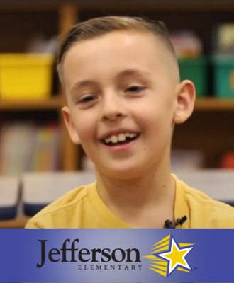  Smiling 4th Grade student, Haszyn, in a classroom with the Jefferson logo.