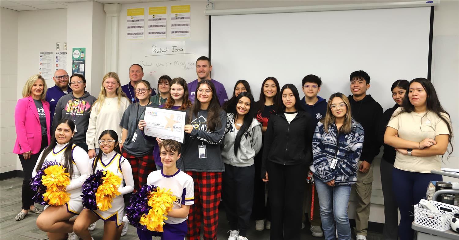 GISH Entrepreneurship Pathway students smiling with their big check of a classroom grant.