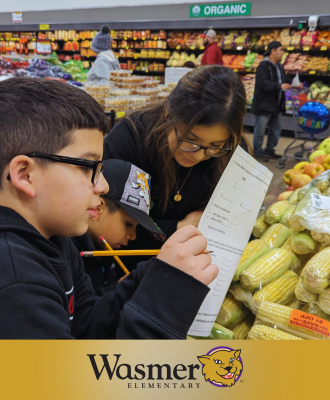  Family working on fun math problems at the Super Saver produce section.