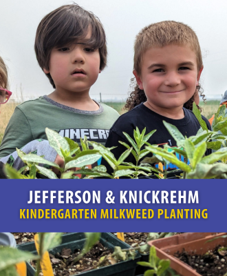  Two smiling kindergartners behind a row of potted milkweed.