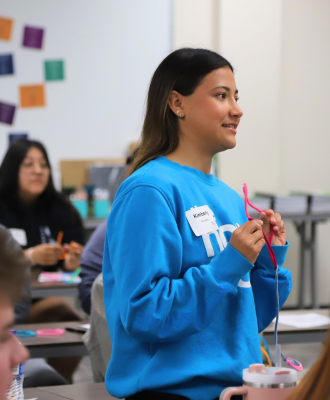  GISH Senior, Kimberly, sharing her pipe cleaner "future plans" project with the 'Next Wave' Camp.