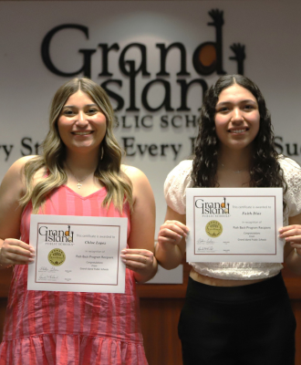  Chloe Lopez & Faith Diaz smiling in the GIPS Board room with their PathBack certificates.