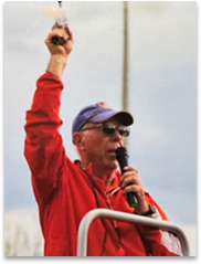 Larry Rutar starting a race at a Track & Field event.