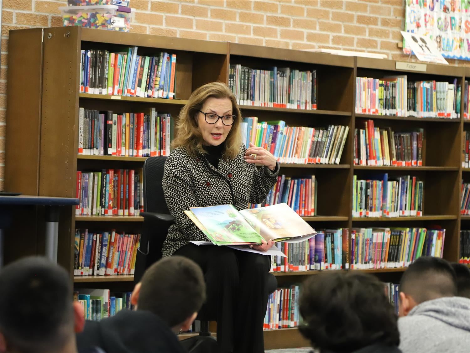 Nebraska First Lady, Suzanne Pillen, reading to 4th grade students at the Howard Elementary media center.