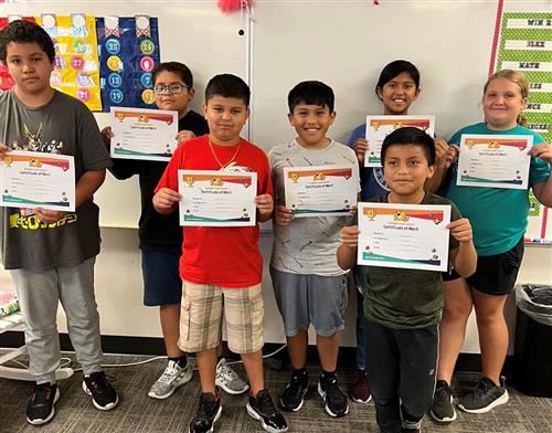 Dodge 5th Graders smiling with their Math Competition certificates