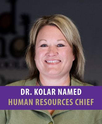  Dr. Carrie Kolar headshot with text: "Dr. Kolar Named Human Resources Chief".